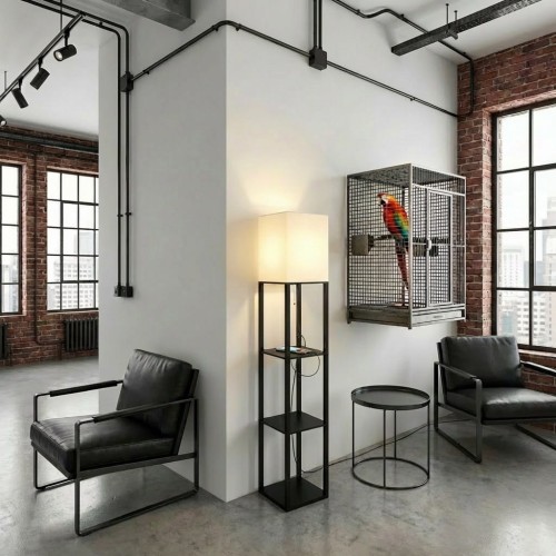 Pokój loftowy z lampą, fotelem, stołem i czarnymi rurkami.jpg